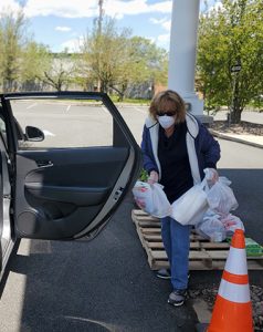 Boyertown Area Multi Services recipient putting food in her car