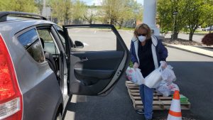 Boyertown Area Multi Services recipient putting food in her car