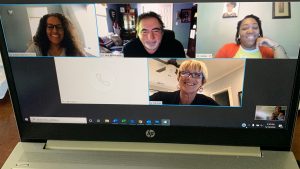 Photo of Zoom meeting with smiling participants