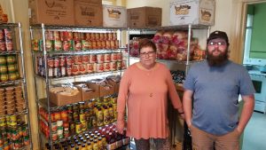Safety Net Services - man and woman standing in food pantry