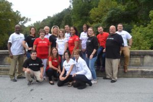 United Way of Berks County, a variety of individuals from diverse groups standing on a bridge and smiling