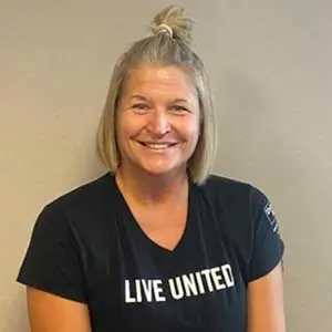 A woman is smiling at the camera