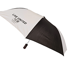 A black and white compact umbrella with the words Live United on it along with the United Way logo