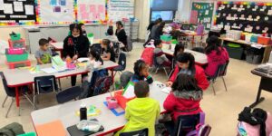A photo of children in a classroom
